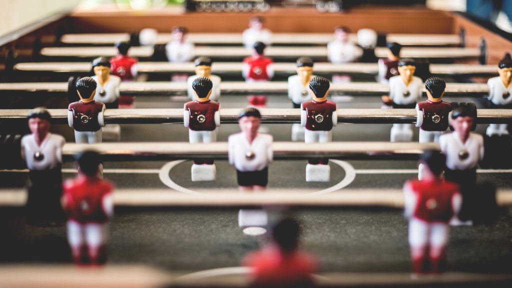Macro shot of a Foosball table from one player's perspective