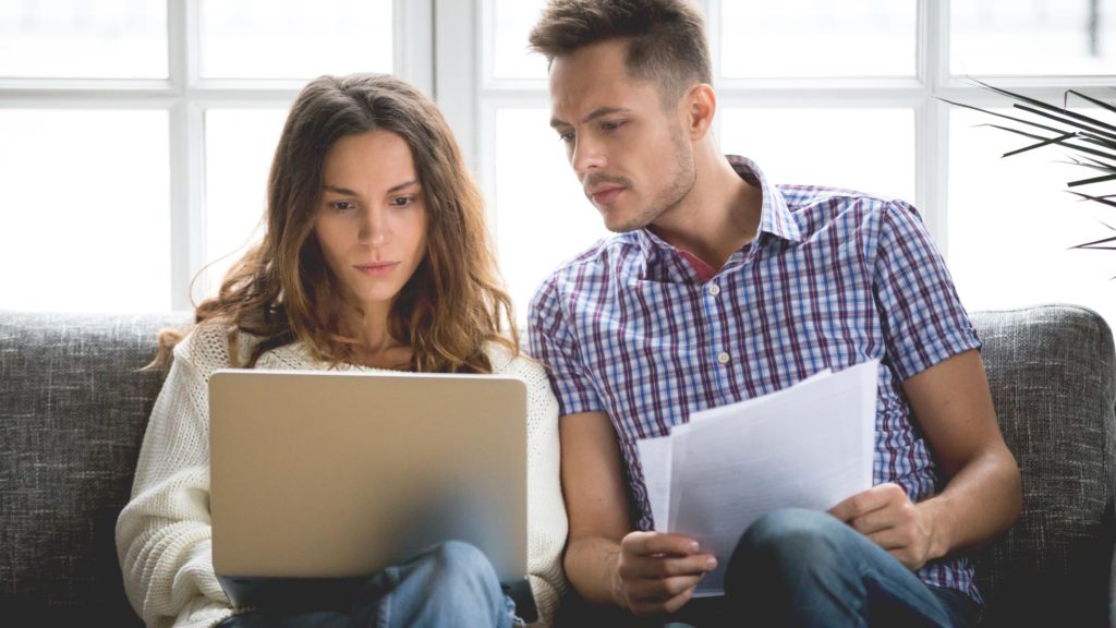Photo of a couple looking at their online beneficiary status