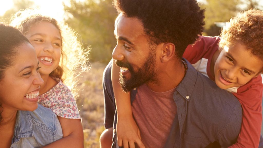 African American family having fun together outdoors
