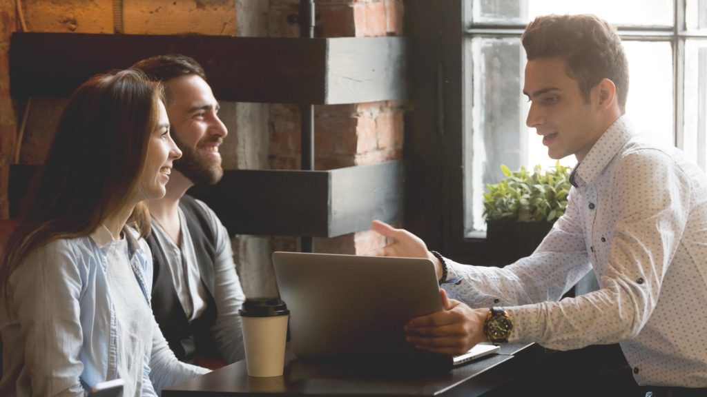 A young couple working with a financial planner