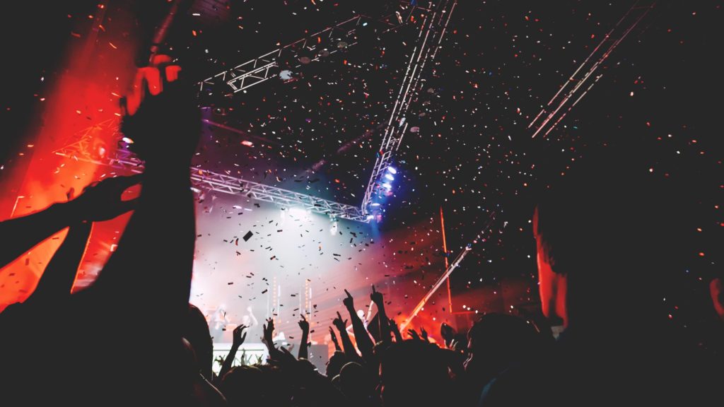 Crowd level photo of an arena concert