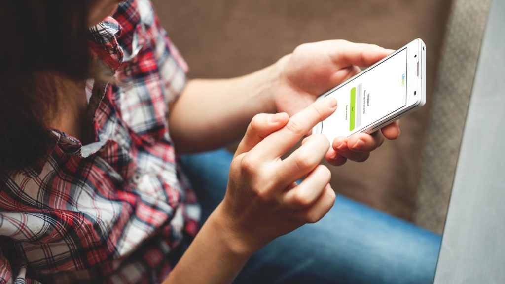 Female using the LifeMart app on her smart phone